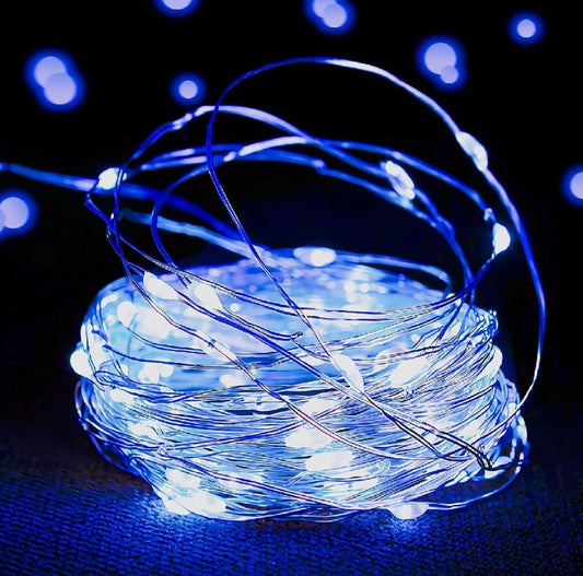 Coiled string of blue LED lights on a dark background